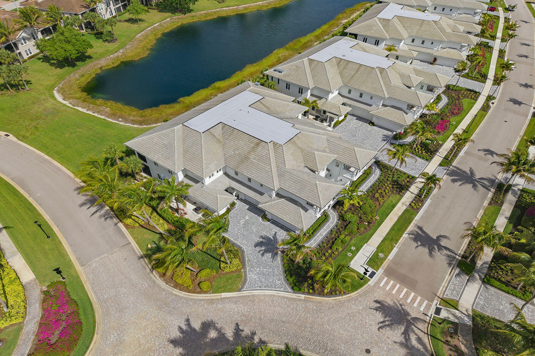 3291 Dorado Lane, Unit 101 Naples, FL 34114 - Photo 28 of 50 an aerial view of a house with a yard and potted plants