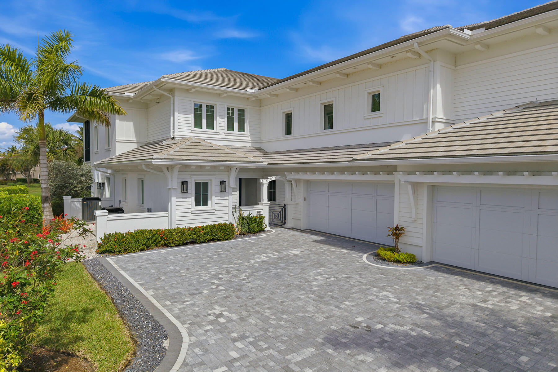 3291 Dorado Lane, Unit 101 Naples, FL 34114 - Photo 30 of 50 a front view of a house with a yard and garage
