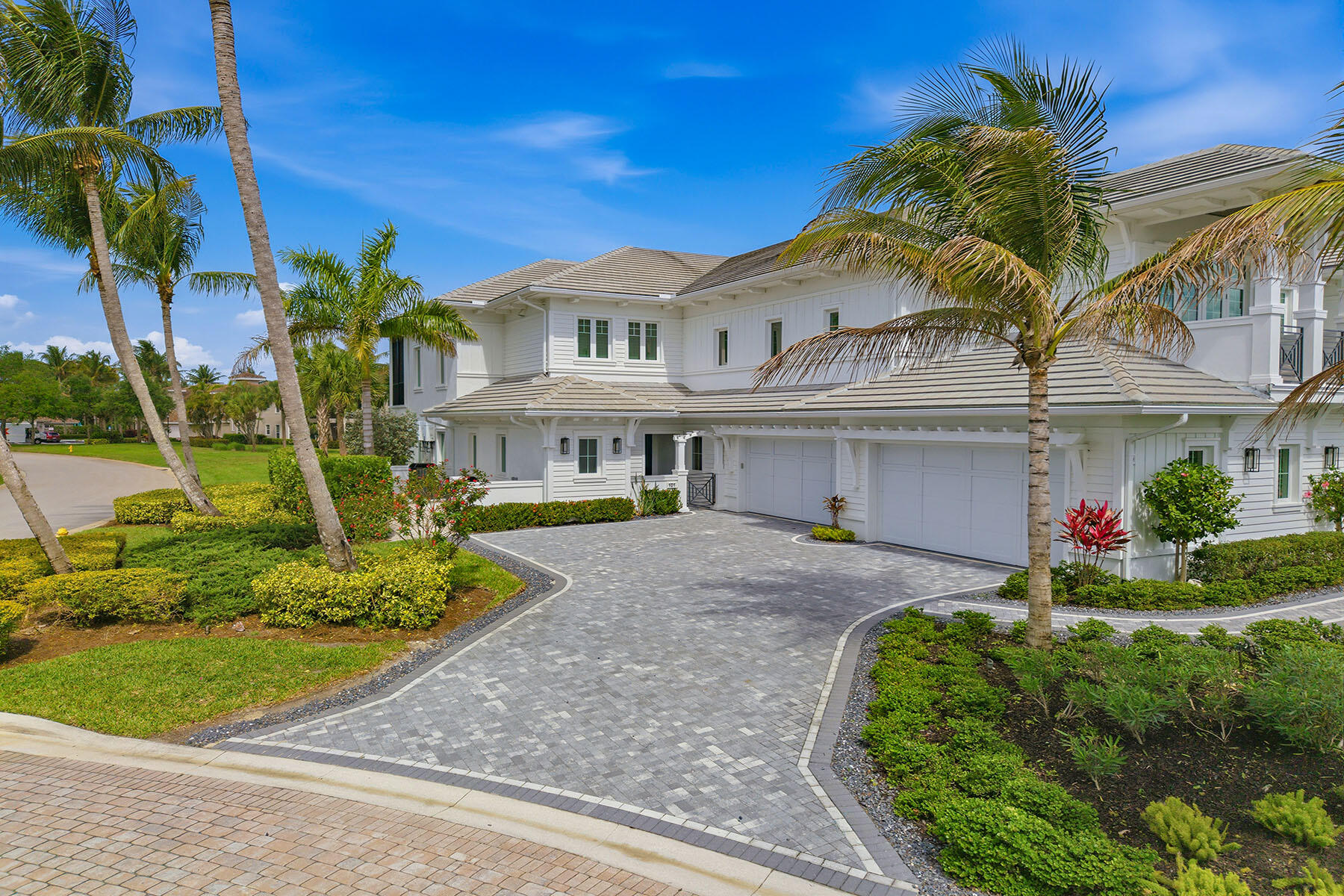 3291 Dorado Lane, Unit 101 Naples, FL 34114 - Photo 31 of 50 a front view of a house with a garden and plants