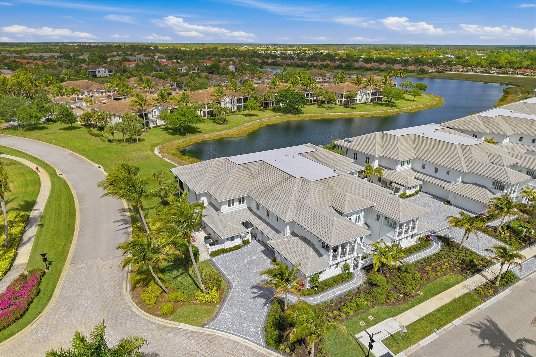 3291 Dorado Lane, Unit 101 Naples, FL 34114 - Photo 32 of 50 an aerial view of residential houses with outdoor space