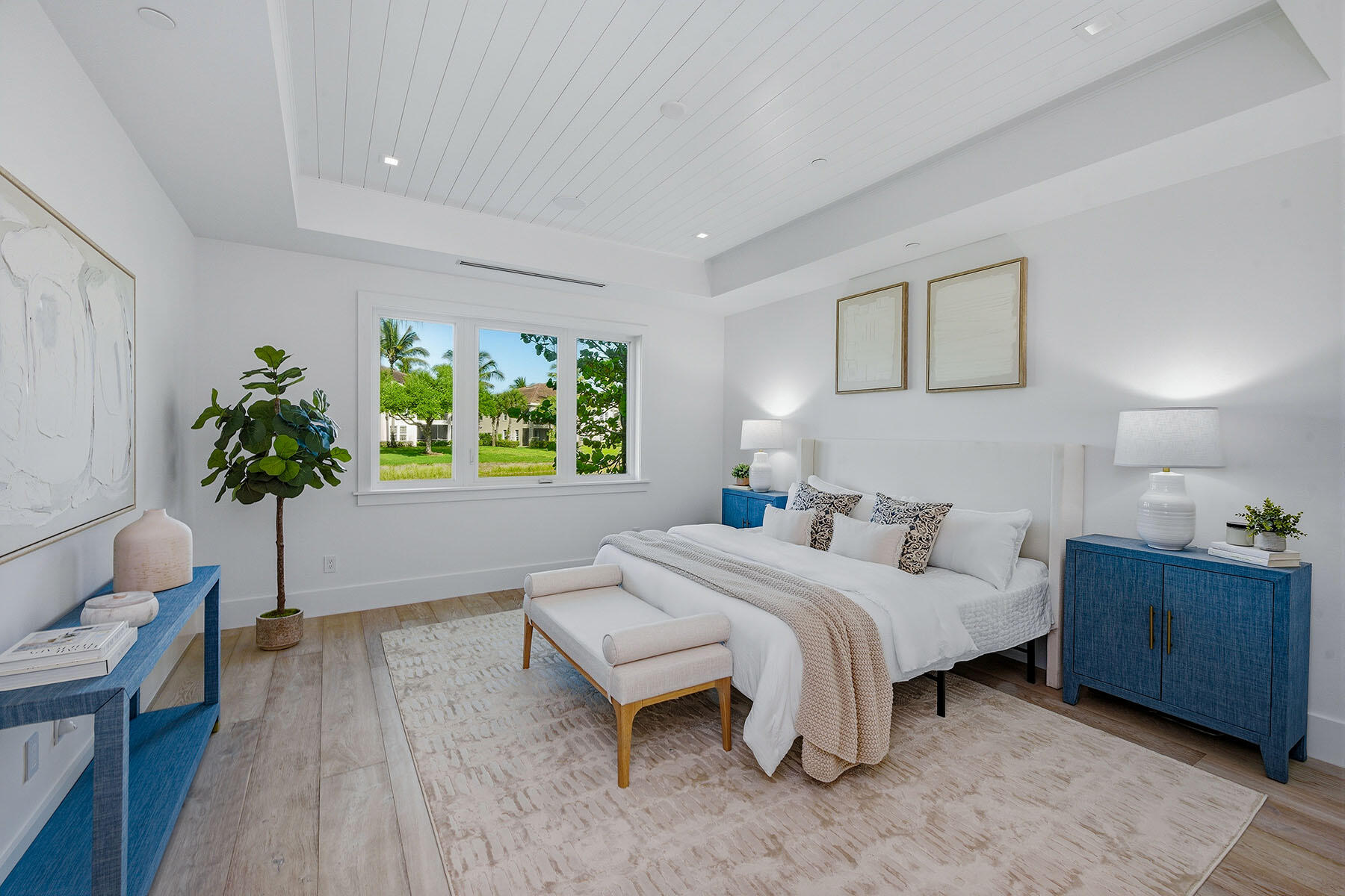 3291 Dorado Lane, Unit 101 Naples, FL 34114 - Photo 10 of 50 a bedroom with a bed and a potted plant