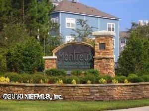 8550 Touchton Road, Unit 224 Jacksonville, FL 32216 - Photo 1 of 17 a front view of a house with garden