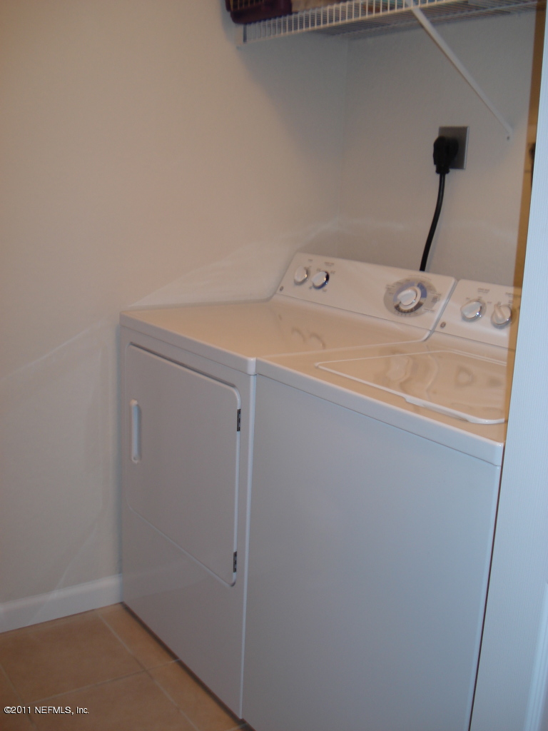 8550 Touchton Road, Unit 224 Jacksonville, FL 32216 - Photo 13 of 17 a utility room with dryer and washer