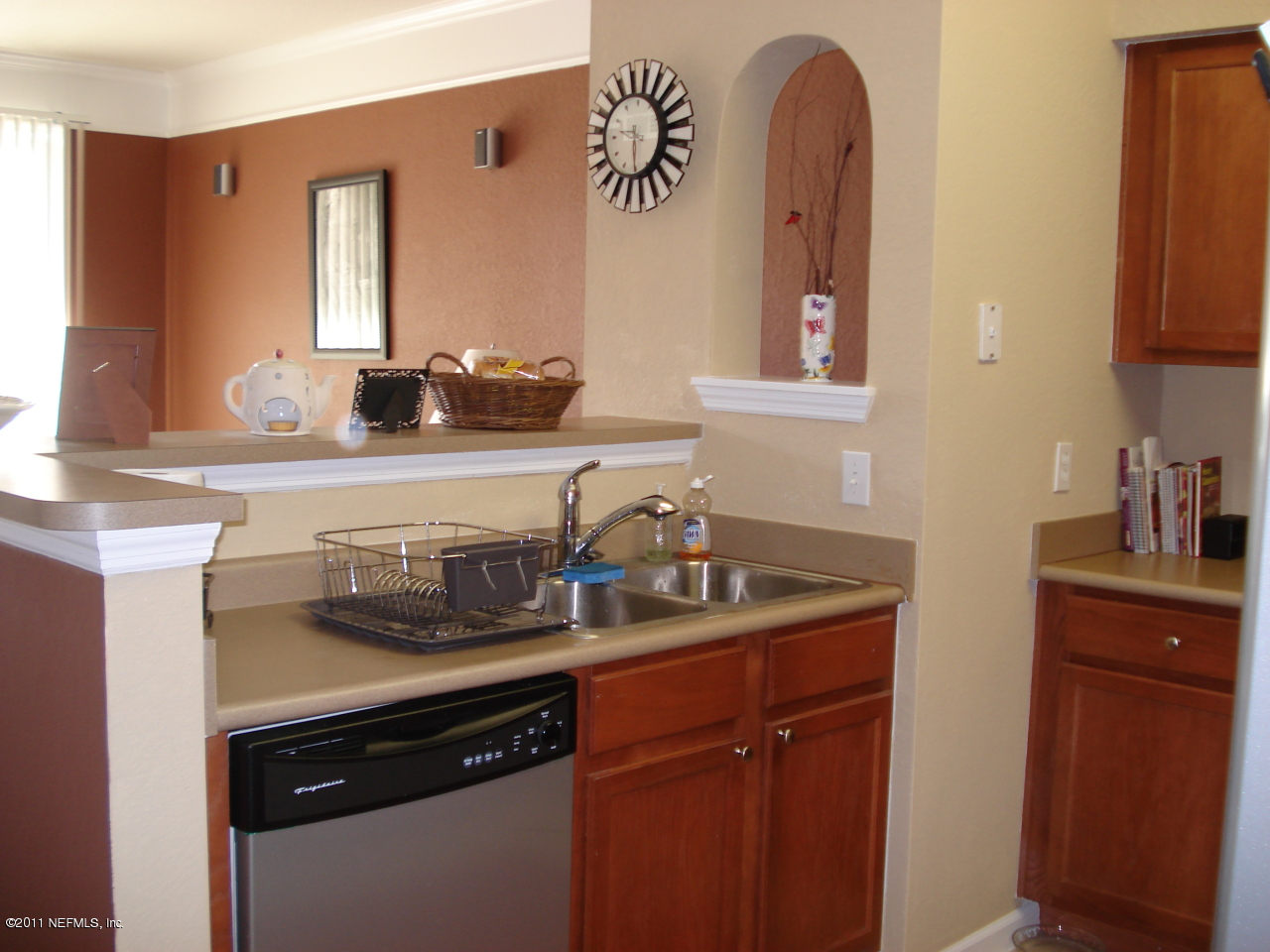 8550 Touchton Road, Unit 224 Jacksonville, FL 32216 - Photo 3 of 17 a kitchen with a sink and cabinets