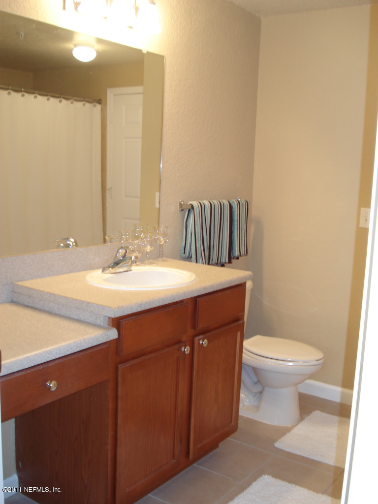 8550 Touchton Road, Unit 224 Jacksonville, FL 32216 - Photo 10 of 17 a bathroom with a sink and a toilet