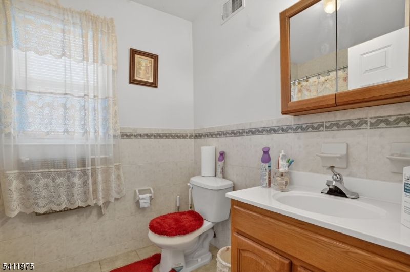 532 Walnut Street Elizabeth, NJ 07201 - Photo 12 of 15 a bathroom with a sink and a toilet