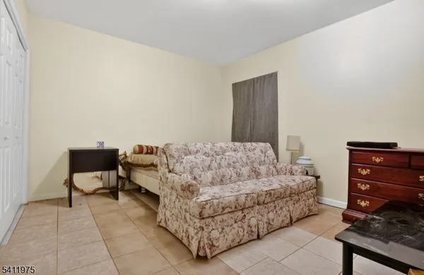 a bedroom with a bed and cabinets