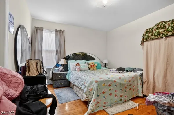 a bedroom with bed and a window