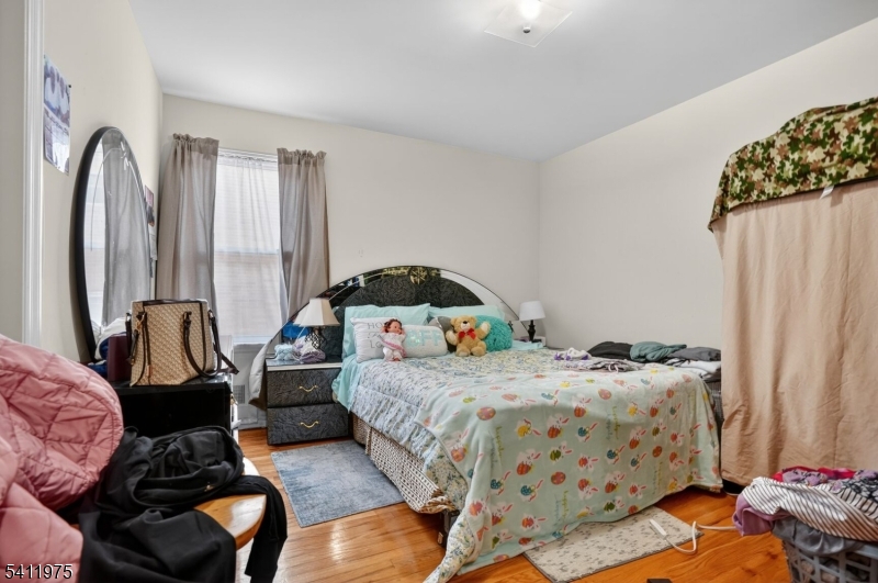 532 Walnut Street Elizabeth, NJ 07201 - Photo 9 of 15 a bedroom with bed and a window