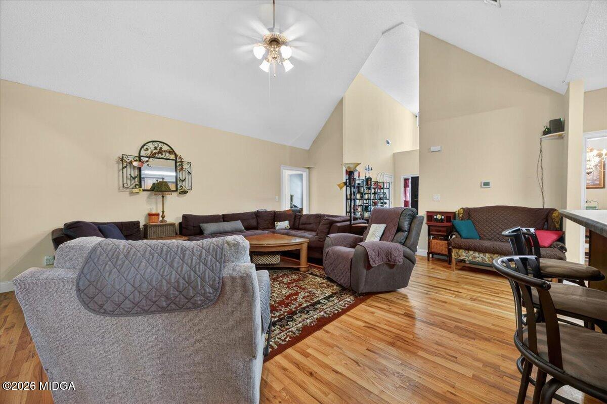 619 Grayridge Road Gray, GA 31032 - Photo 5 of 40 a living room with furniture and a chandelier