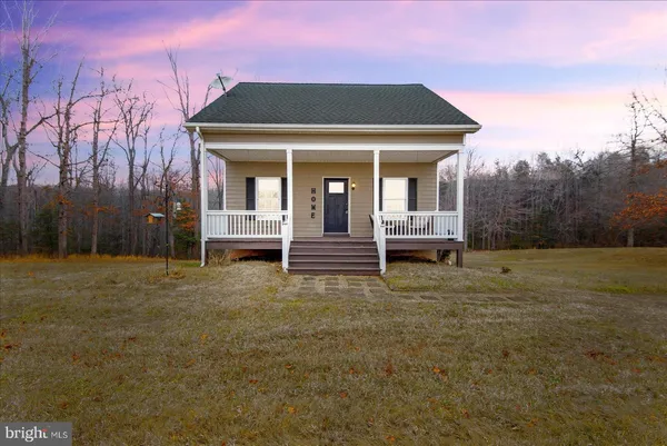 a front view of a house with a porch