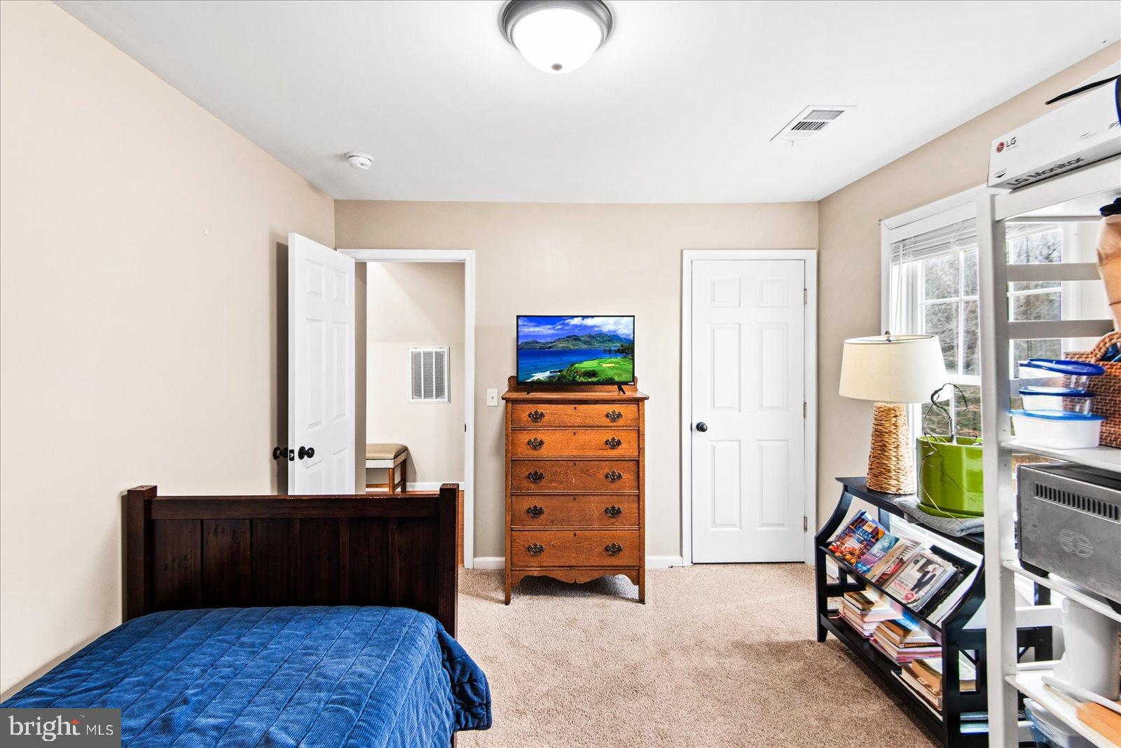 11310 St Just Road Unionville, VA 22567 - Photo 20 of 40 Cozy bedroom with natural light and charm.