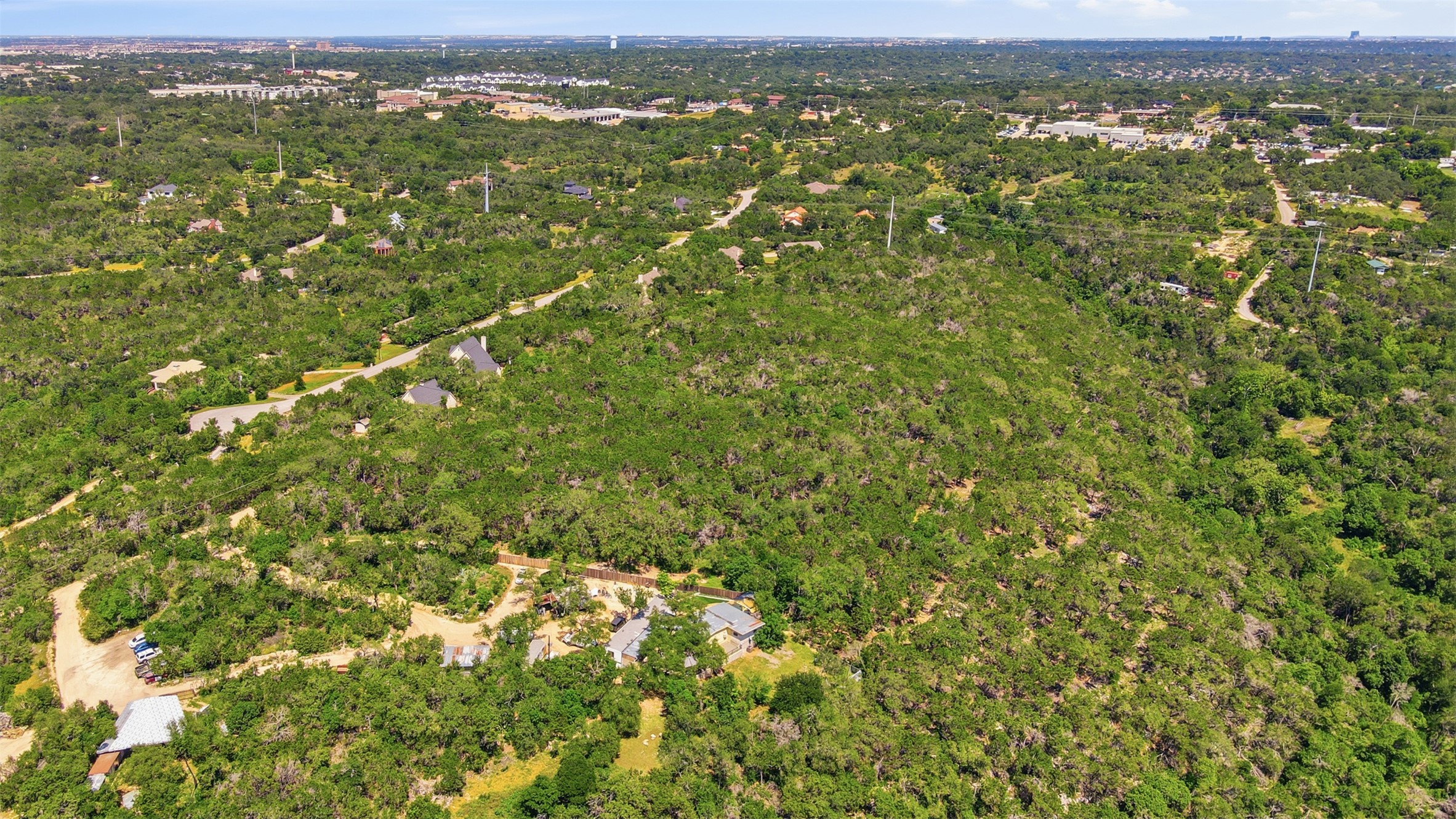 0 North Ranch Road 620 Road Austin, TX 78726 - Photo 6 of 20 an aerial view of residential houses with outdoor space and trees