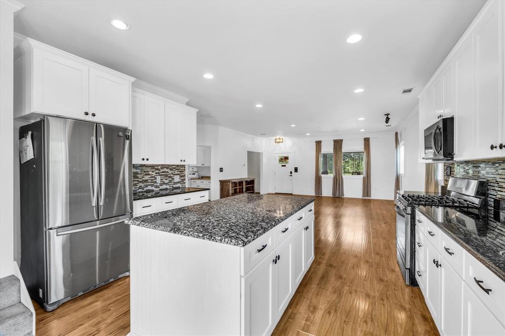 348 Barker Lane Waco, TX 76705 - Photo 12 of 39 a kitchen with stainless steel appliances granite countertop a refrigerator and a sink
