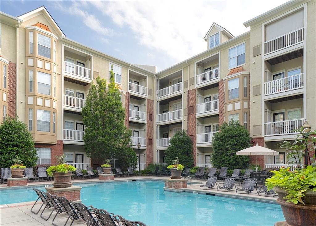 4102 Westchester Ridge Northeast Brookhaven, GA 30329 - Photo 31 of 35 a building with swimming pool and outdoor seating