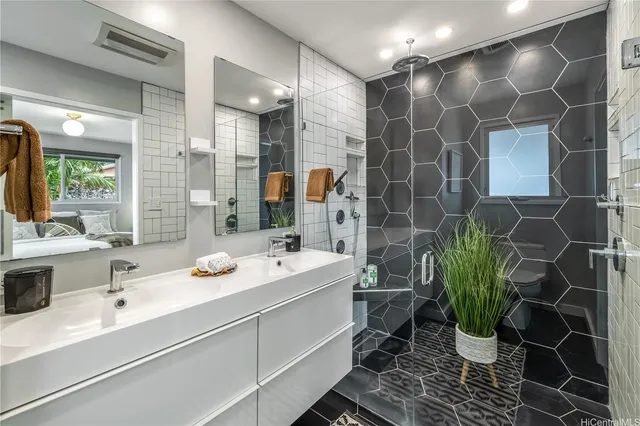 a bathroom with a sink and mirror