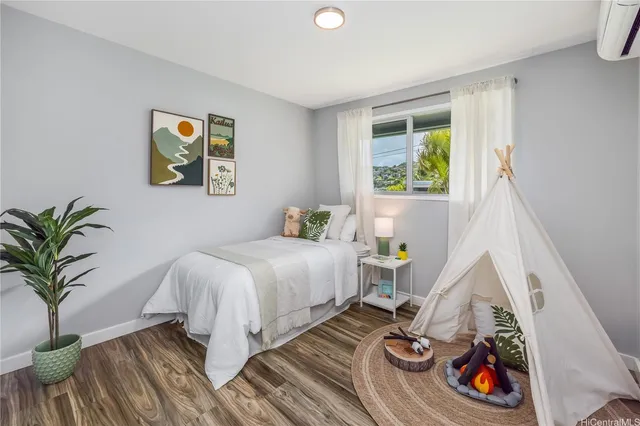 a bedroom with a bed and a couch