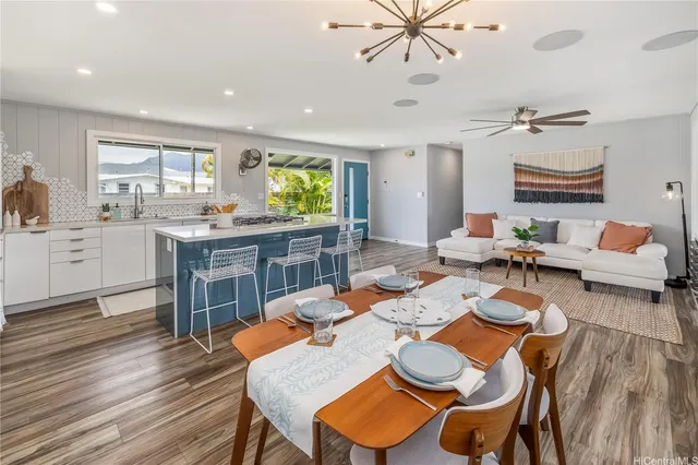 a view of a dining room with furniture and a wooden floor