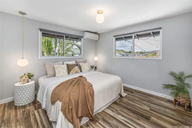 a bedroom with bed and window