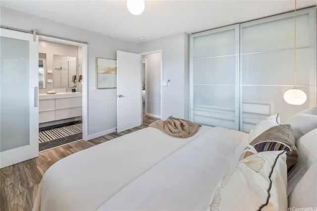 a bedroom with a bed and walk in closet