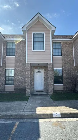 a front view of a house with yard
