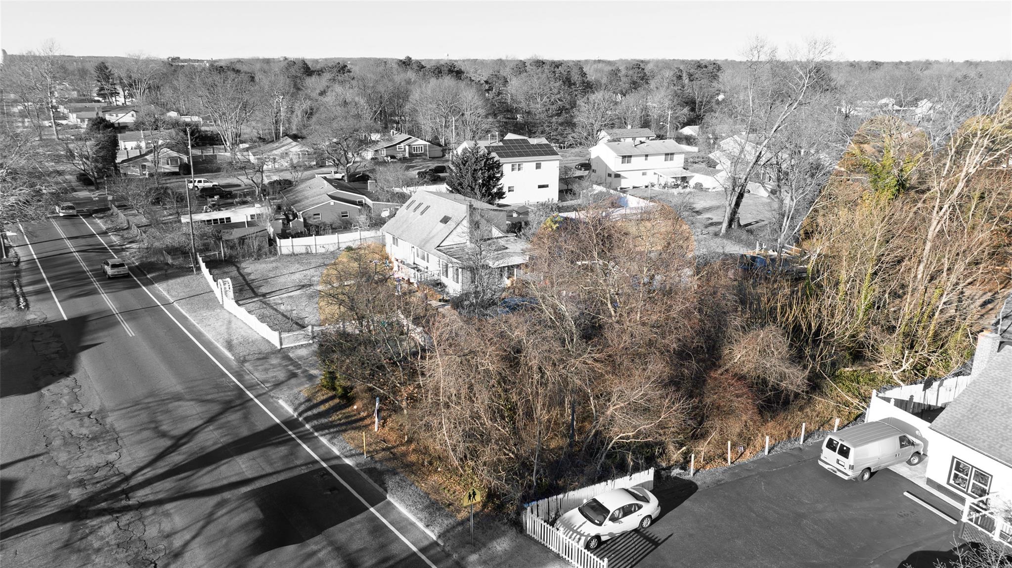 Howells Road Bay Shore, NY 11706 - Photo 2 of 15 Birds eye view of property featuring a forest view and a residential view