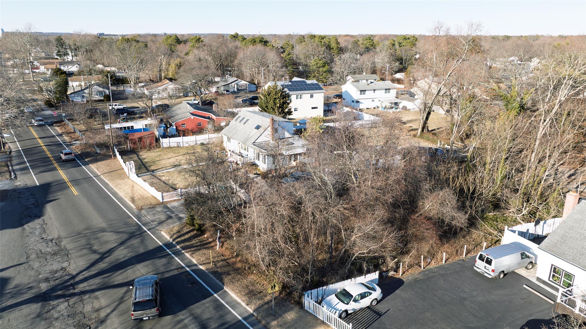 Howells Road Bay Shore, NY 11706 - Photo 3 of 15 Birds eye view of property with a forest view and a residential view