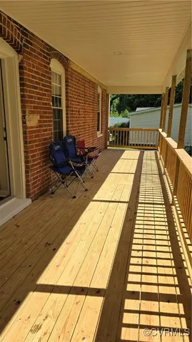 a view of balcony with wooden floor and outdoor space