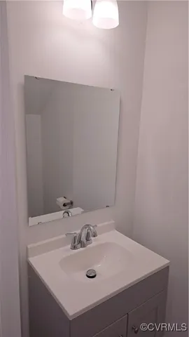 a bathroom with a sink and a vanity