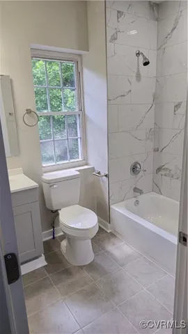 a bathroom with a toilet a sink and a bathtub