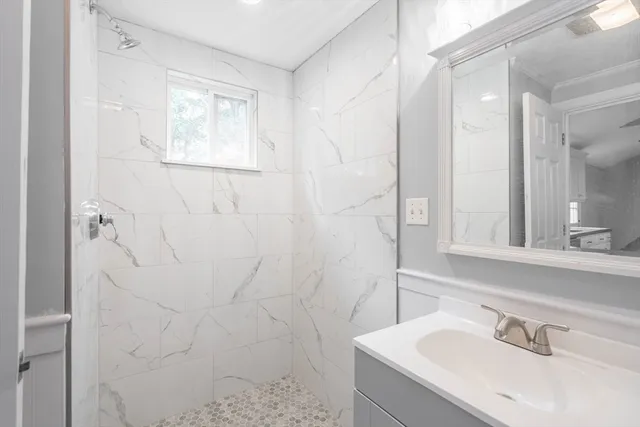 a bathroom with a sink and a mirror