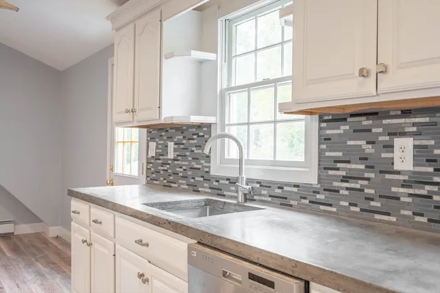 a bathroom with a sink and a window