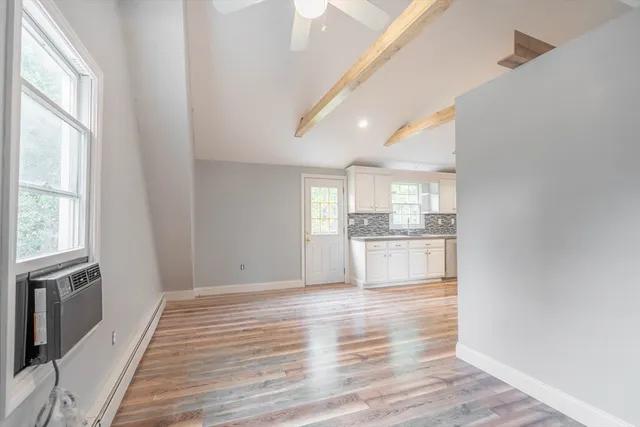 a view of a kitchen cabinets and wooden floor