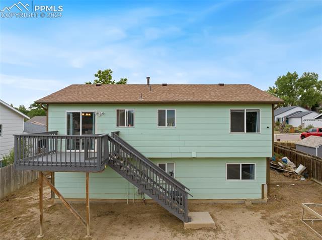 604 Wheat Field Road Fountain, CO 80817 - Photo 29 of 33 Back of house with a deck