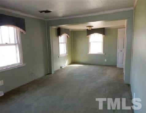 1027 Cavel Chub Lake Road Roxboro, NC 27574 - Photo 11 of 17 an empty room that has a window