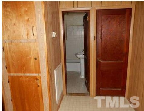 1027 Cavel Chub Lake Road Roxboro, NC 27574 - Photo 12 of 17 a view of a bathroom from a hallway