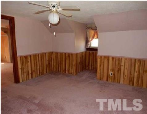 1027 Cavel Chub Lake Road Roxboro, NC 27574 - Photo 16 of 17 a view of a hallway with wooden floor