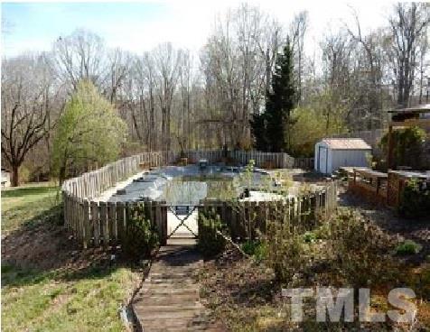 1027 Cavel Chub Lake Road Roxboro, NC 27574 - Photo 6 of 17 a view of backyard with patio and outdoor seating