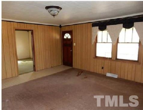 1027 Cavel Chub Lake Road Roxboro, NC 27574 - Photo 8 of 17 an empty room with windows and entrance
