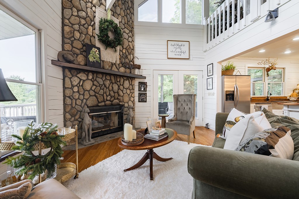 328 Black Ankle Creek Road Cherry Log, GA 30522 - Photo 6 of 103 a living room with furniture a rug and a fireplace