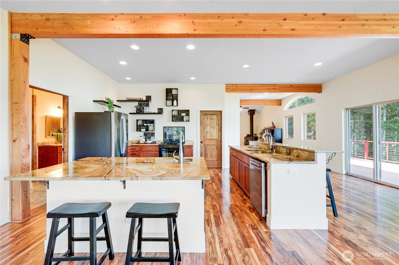 83 Octopus Court Quilcene, WA 98376 - Photo 10 of 40 a large kitchen with a table and chairs in it