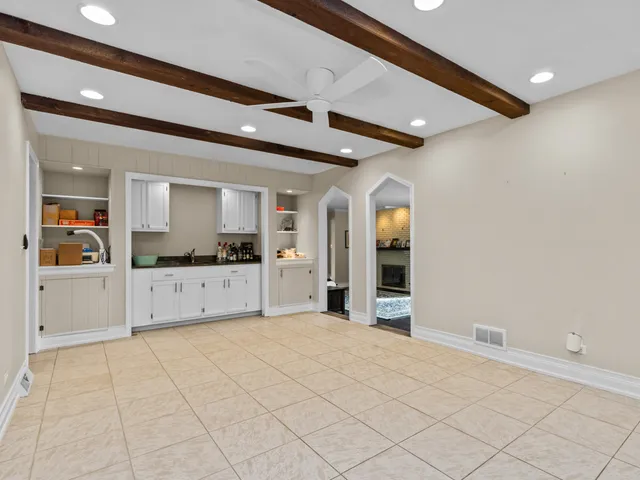a view of a kitchen with cabinet and window
