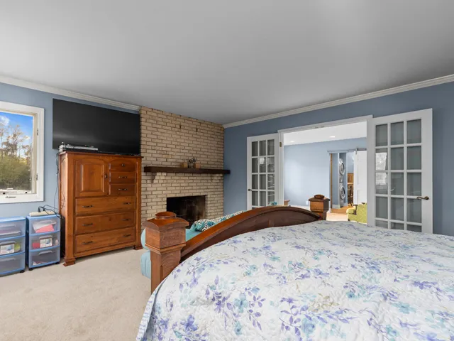 a bedroom with a bed and dresser