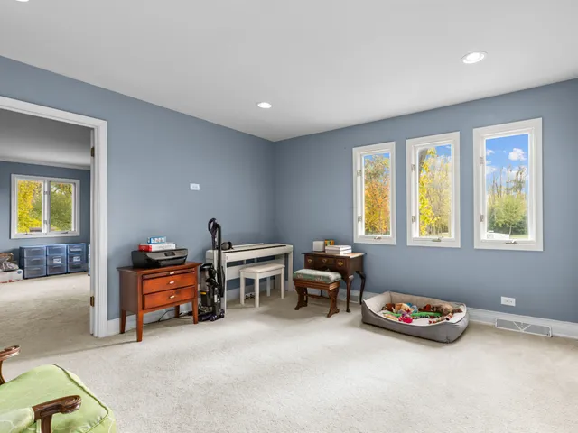 a bedroom with furniture and a window