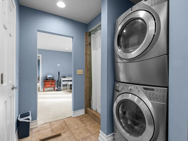 a view of a hallway with washer and dryer