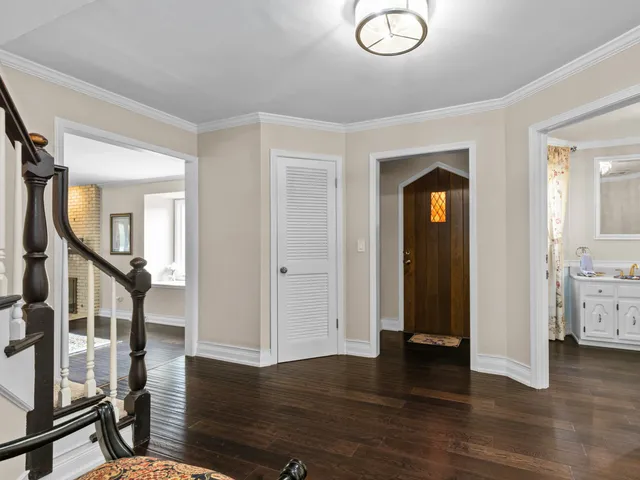 wooden floor with fireplace and windows in a room