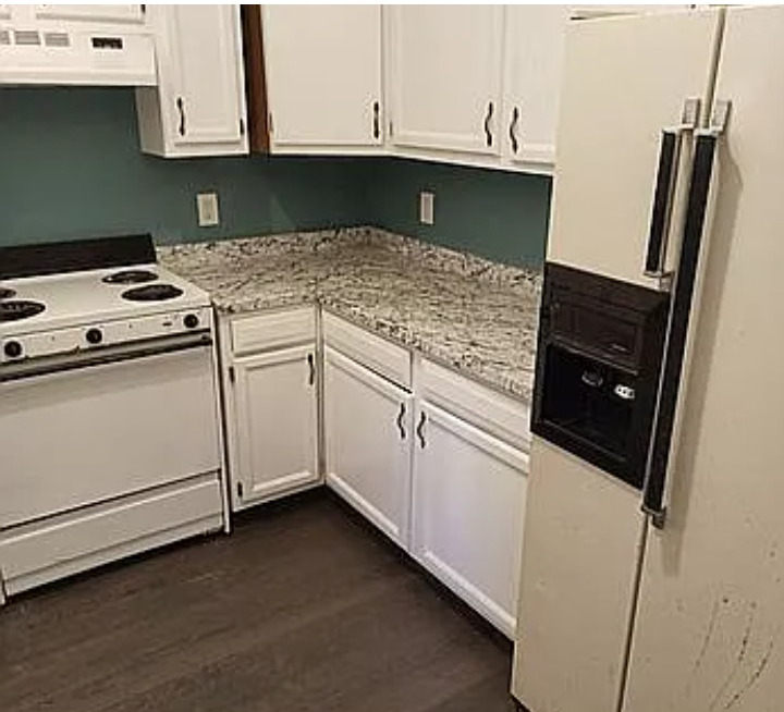 105 South Liberty Street Marion, IL 62959 - Photo 3 of 13 a kitchen with granite countertop white cabinets and white appliances