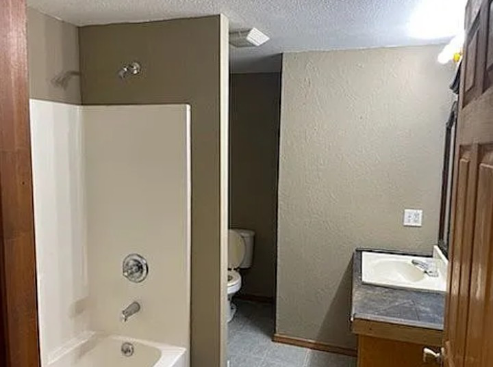 105 South Liberty Street Marion, IL 62959 - Photo 4 of 13 a bathroom with a granite countertop sink and a mirror
