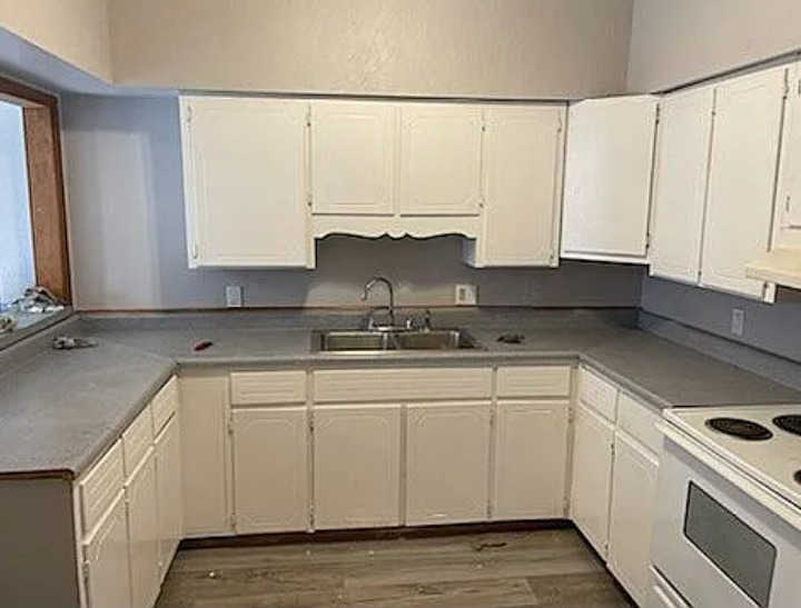 105 South Liberty Street Marion, IL 62959 - Photo 5 of 13 a kitchen with stainless steel appliances granite countertop white cabinets sink and dishwasher
