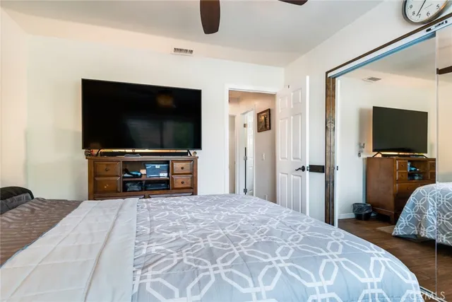 a view of a livingroom with furniture and a flat screen tv